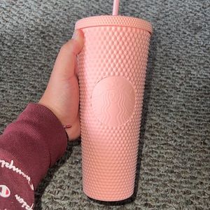 Pink studded Starbucks cup